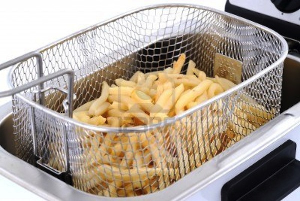 10047134-freshly-baked-french-fries-in-an-electric-frying-pan-basket